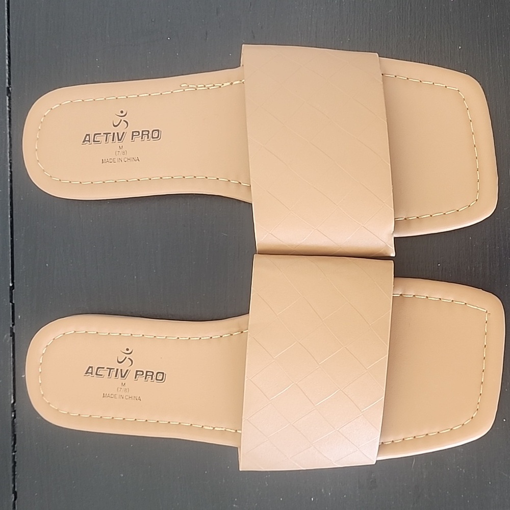 Flat tan slippers
